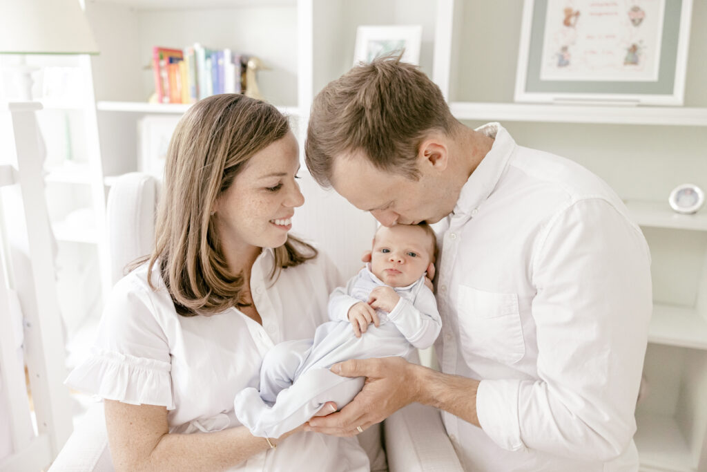 Parents holding newborn baby