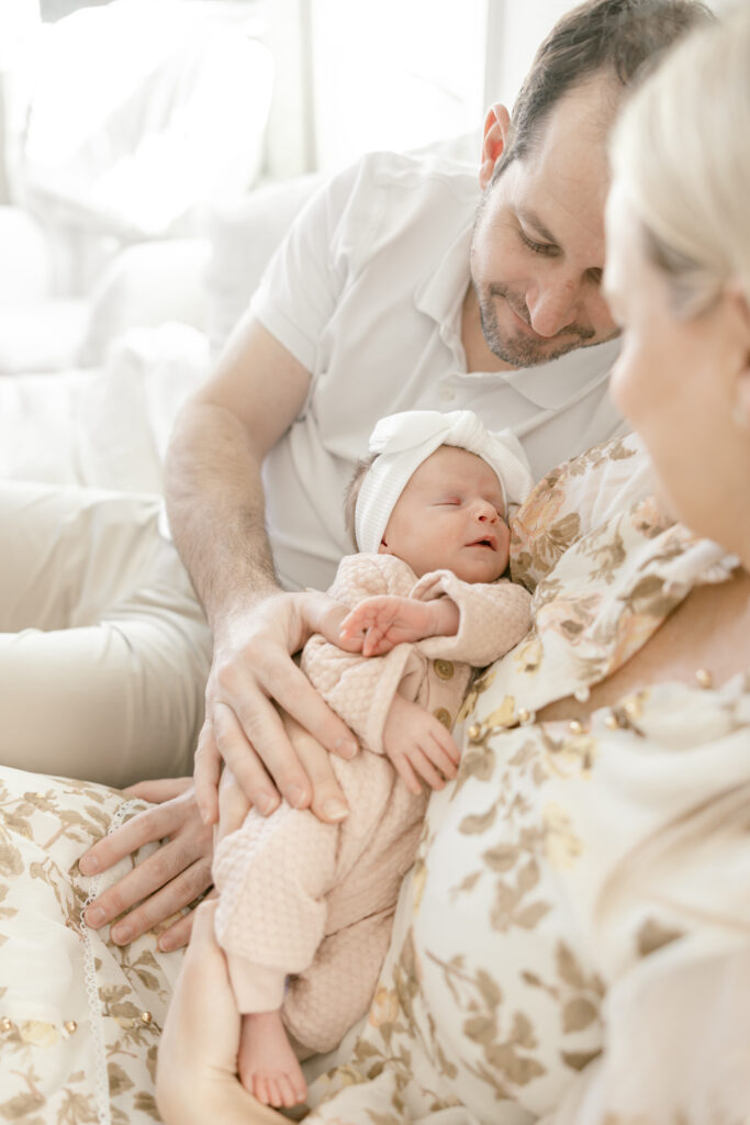 Mother holding newborn during in-home session in Del Ray, Alexandria VA