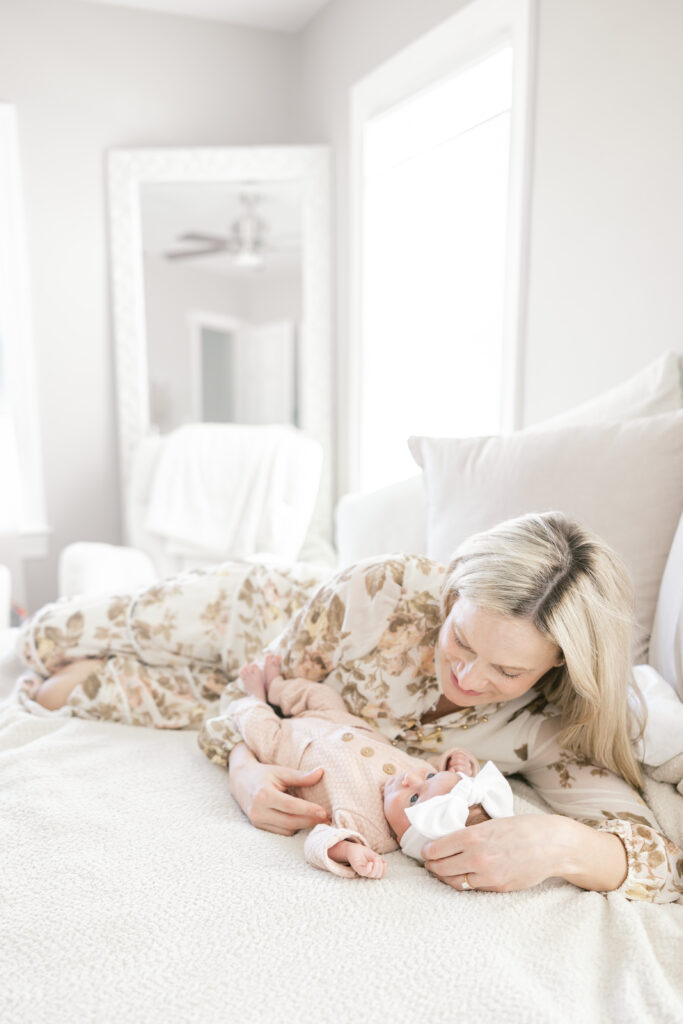 Mother holding newborn during in-home session in Del Ray, Alexandria VA