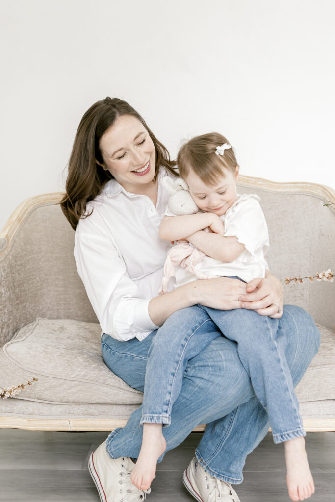 Mother holding child on her lap during a Northern Virginia motherhood session