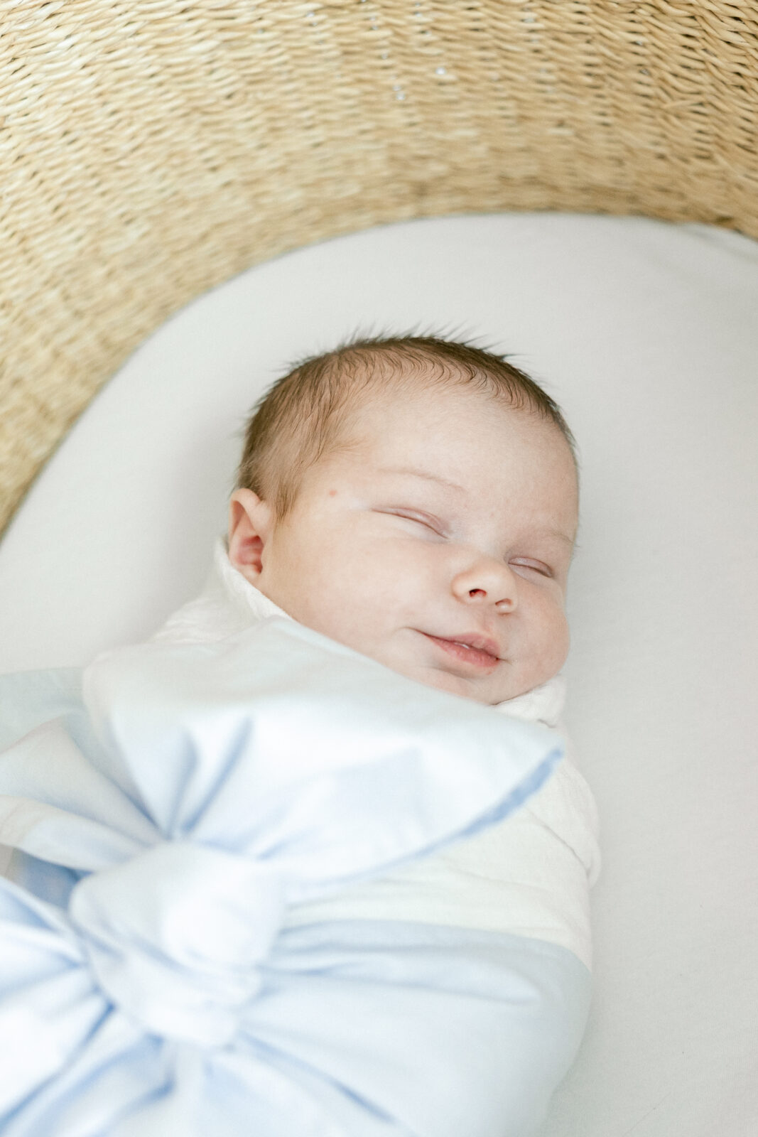 Newborn sleeping peacefully in soft natural light at home in Old Town Alexandria