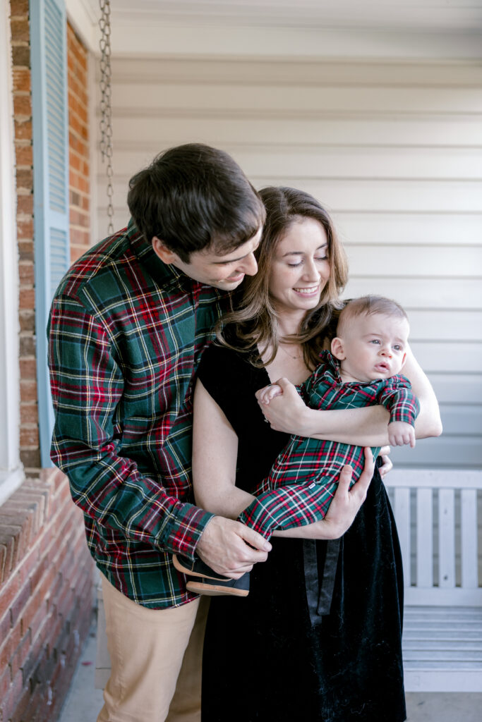 Candid milestone photography of baby with parents