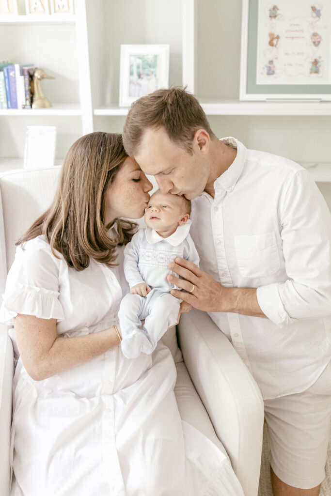 Lifestyle newborn session with parents holding baby