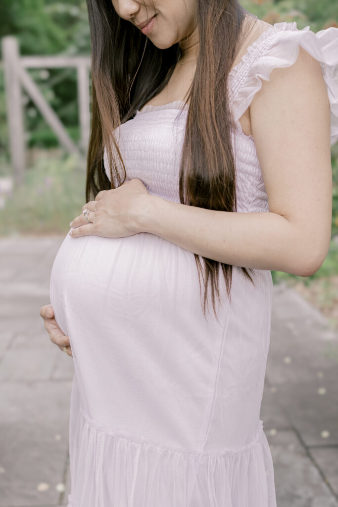 Woman holding her pregnant belly in Washington DC