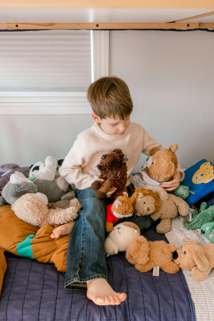 Boy playing with toys at his in-home photography session in Northern Virginia.