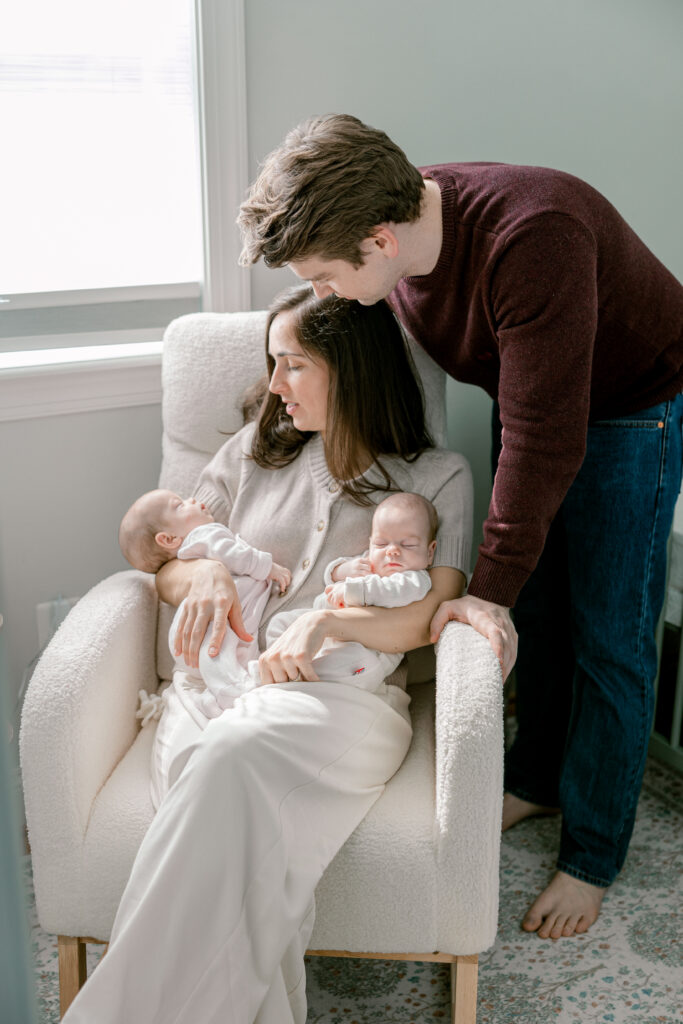 Parents with their newborn baby twins during an in-home newborn session in Arlington VA
